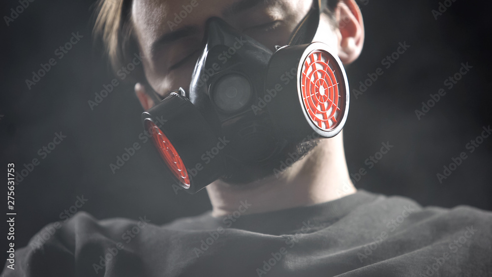 Male in respirator sleeping in smoke, protection from suffocation when fire  Stock Photo | Adobe Stock