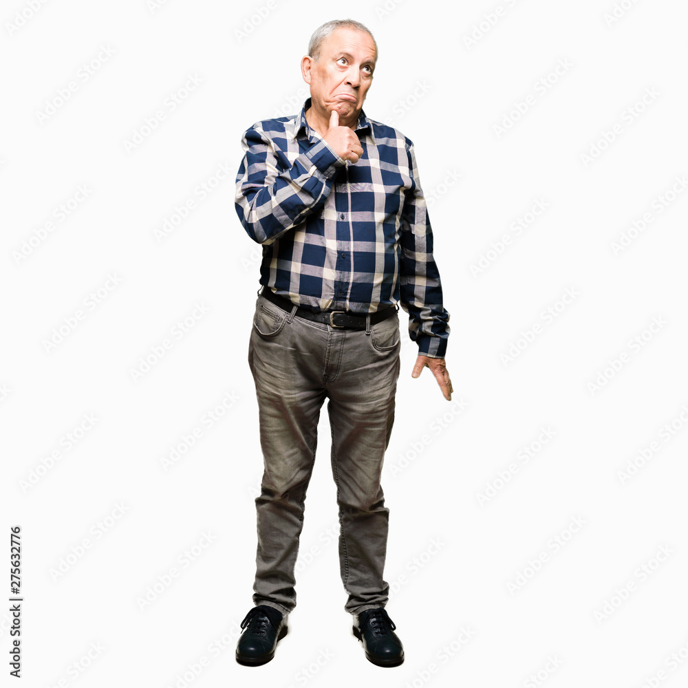 Handsome senior man wearing casual shirt with hand on chin thinking about question, pensive expression. Smiling with thoughtful face. Doubt concept. Handsome senior man wearing casual shirt with hand on chin thinking about question, pensive expression. Smiling with thoughtful face. Doubt concept.