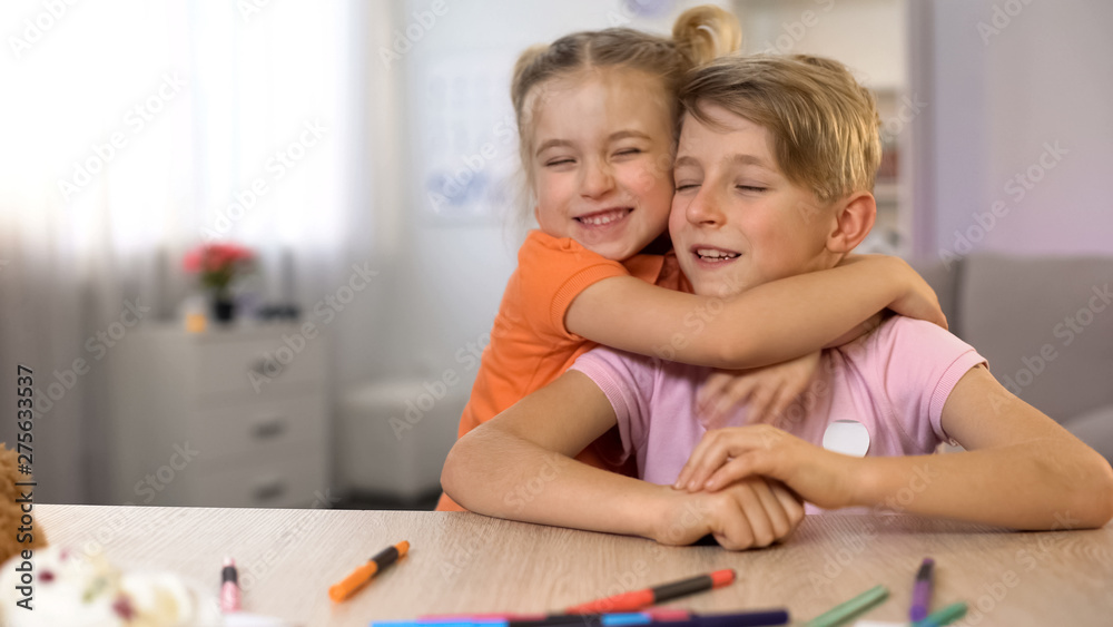 Little brother and sister hugging family togetherness, childish tender relations