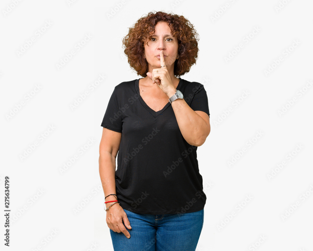 Beautiful middle ager senior woman over isolated background asking to be quiet with finger on lips. Silence and secret concept. Beautiful middle ager senior woman over isolated background asking to be quiet with finger on lips. Silence and secret concept.