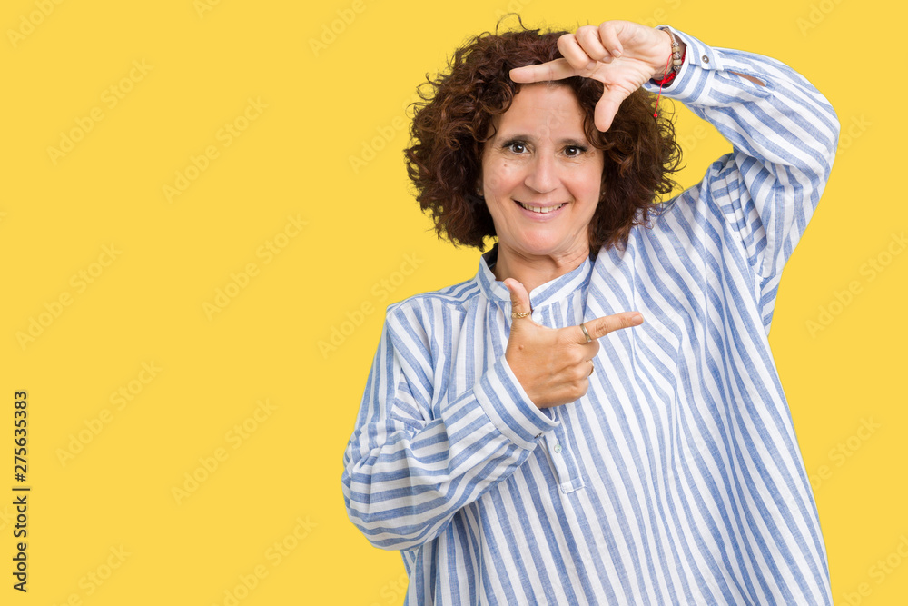 Beautiful middle ager senior woman wearing navy shirt over isolated background smiling making frame with hands and fingers with happy face. Creativity and photography concept. Beautiful middle ager senior woman wearing navy shirt over isolated background smiling making frame with hands and fingers with happy face. Creativity and photography concept.