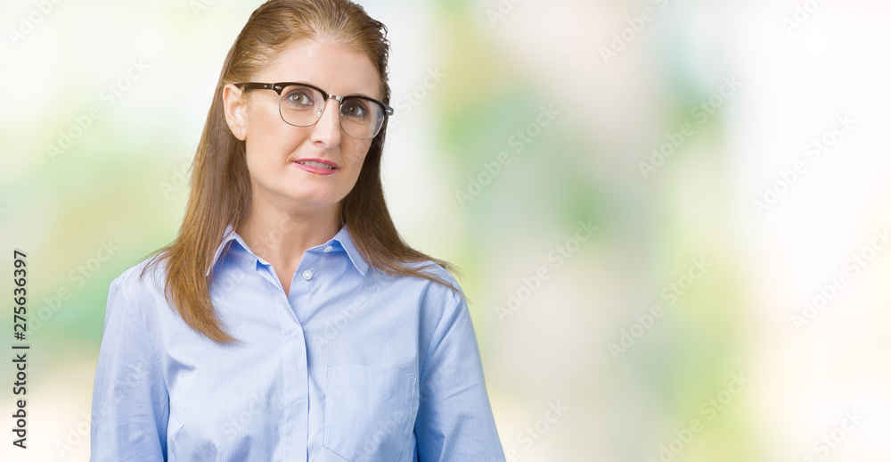 Beautiful middle age mature business woman wearing glasses over isolated background Hands together and fingers crossed smiling relaxed and cheerful. Success and optimistic Beautiful middle age mature business woman wearing glasses over isolated background Hands together and fingers crossed smiling relaxed and cheerful. Success and optimistic