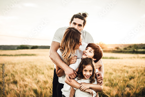 Portrait of a happy and fun family in the countryside. Concept of love family
