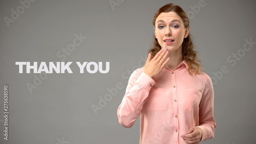 Woman saying thank you in sign language, text on background, communication photo