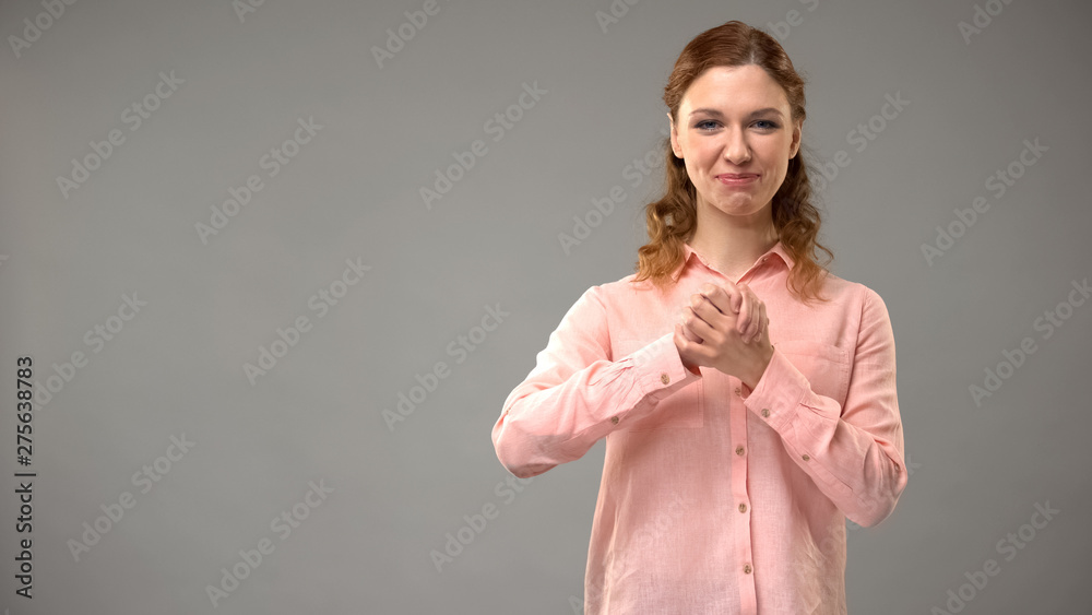 Lady saying believe in sign language, showing words in asl lesson, communication Stock Photo