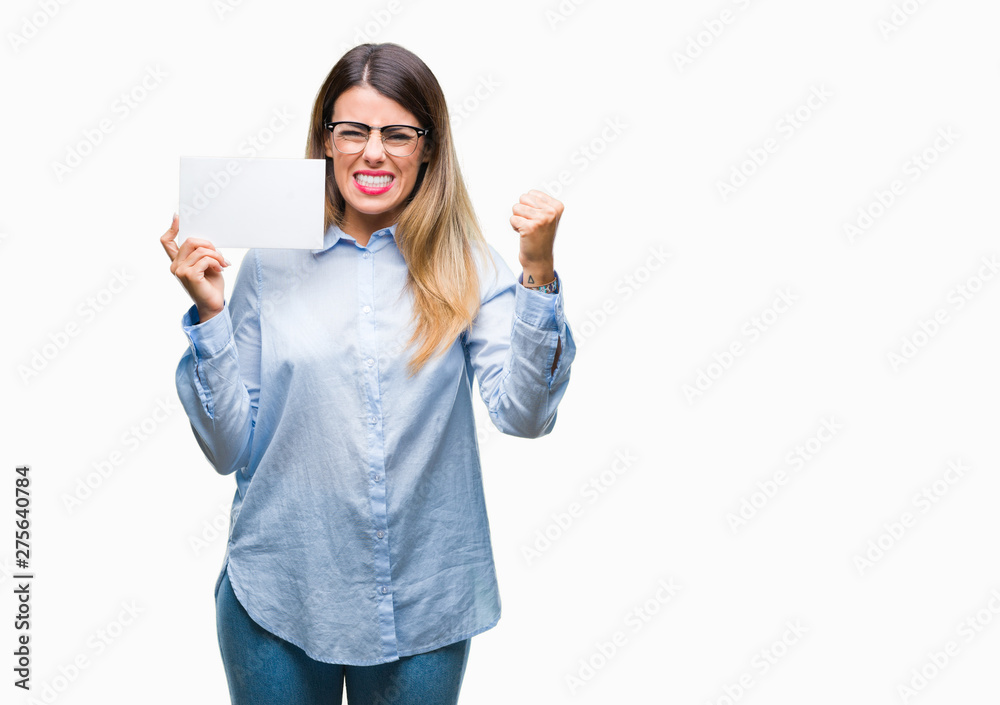 Young beautiful business woman holding blank card over isolated background annoyed and frustrated shouting with anger, crazy and yelling with raised hand, anger concept
