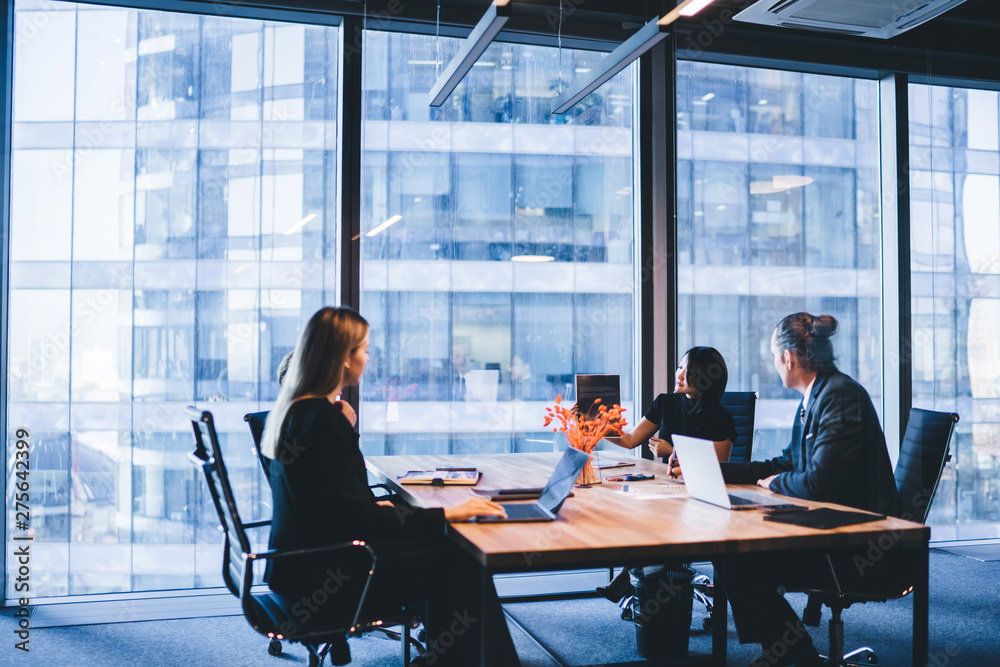© BullRun - Intelligent female director in formal wear presenting financial report during conference with company employees, group of people collaborating on developing business project during brainstorming © BullRun - Intelligent female director in formal wear presenting financial report during conference with company employees, group of people collaborating on developing business project during brainstorming