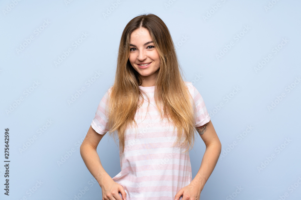 Young woman over isolated blue background laughing Young woman over isolated blue background laughing