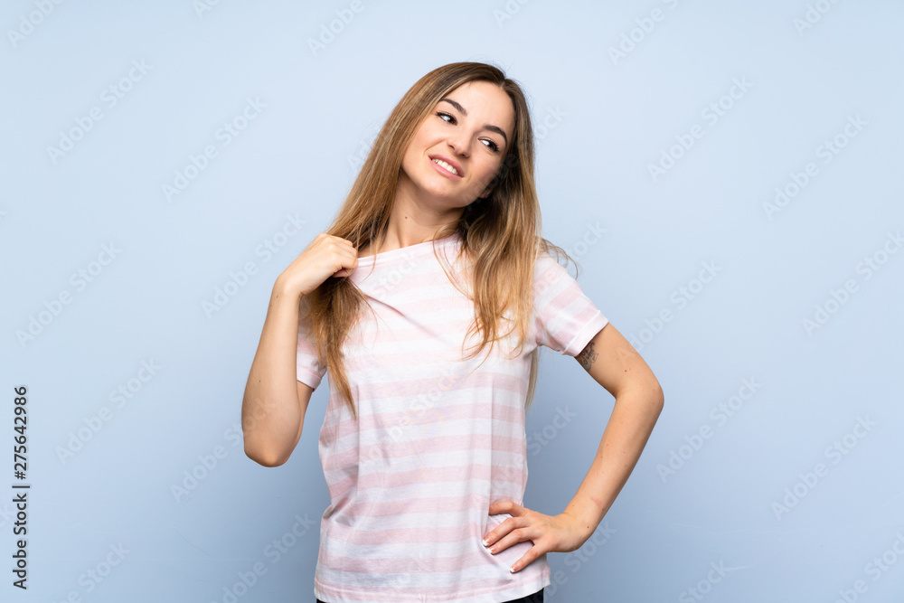 Young woman over isolated blue background with tired and sick expression Young woman over isolated blue background with tired and sick expression