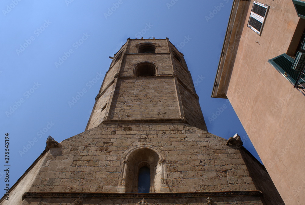 Italy, the island of Sardinia. The city of Alghero. An ancient church tower in the old medieval city dominates the skyline.