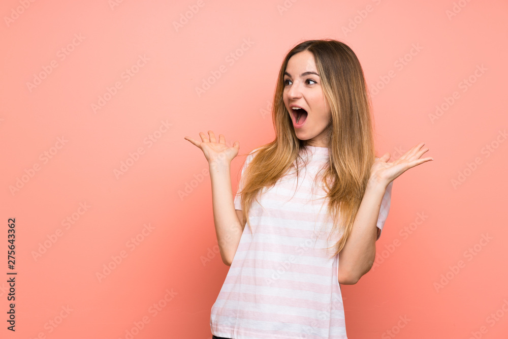 Young woman over isolated pink wall with surprise facial expression Young woman over isolated pink wall with surprise facial expression