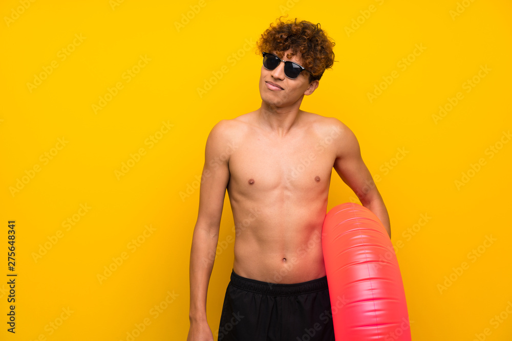 African american man over isolated purple wall standing and looking to the side African american man over isolated purple wall standing and looking to the side