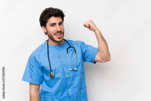 Surgeon doctor man over isolated white wall making strong gesture