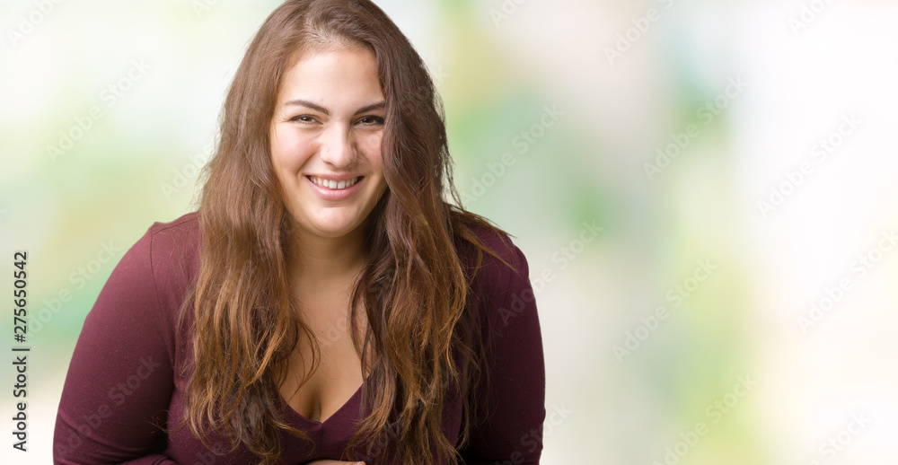 Beautiful and attractive plus size young woman wearing a dress over isolated background Smiling and laughing hard out loud because funny crazy joke. Happy expression.
