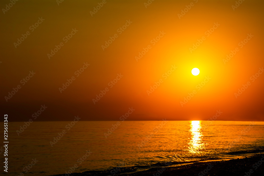 Fototapeta premium Horizontal sunset coastline calm sea with golden sun - Late afternoon on beach waterline with golden direct sunset calm sea ocean - Sun sky sea ocean night time