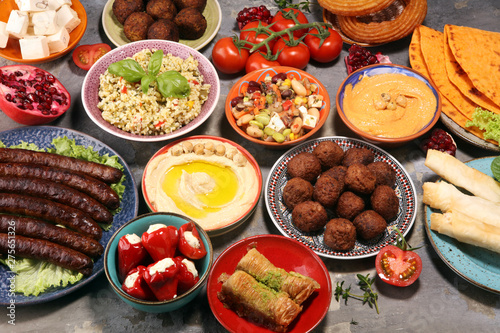 Middle eastern or arabic dishes and assorted meze, concrete rustic background. Falafel. Turkish Dessert Baklava with pistachio. Halal food. Lebanese cuisine