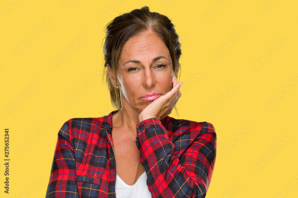 Middle age adult woman wearing casual jacket over isolated background thinking looking tired and bored with depression problems with crossed arms. Middle age adult woman wearing casual jacket over isolated background thinking looking tired and bored with depression problems with crossed arms.