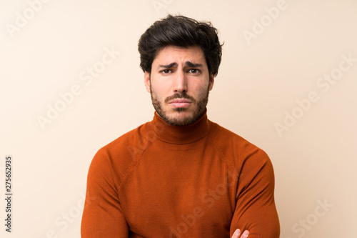 Fotografía Handsome over isolated wall sad