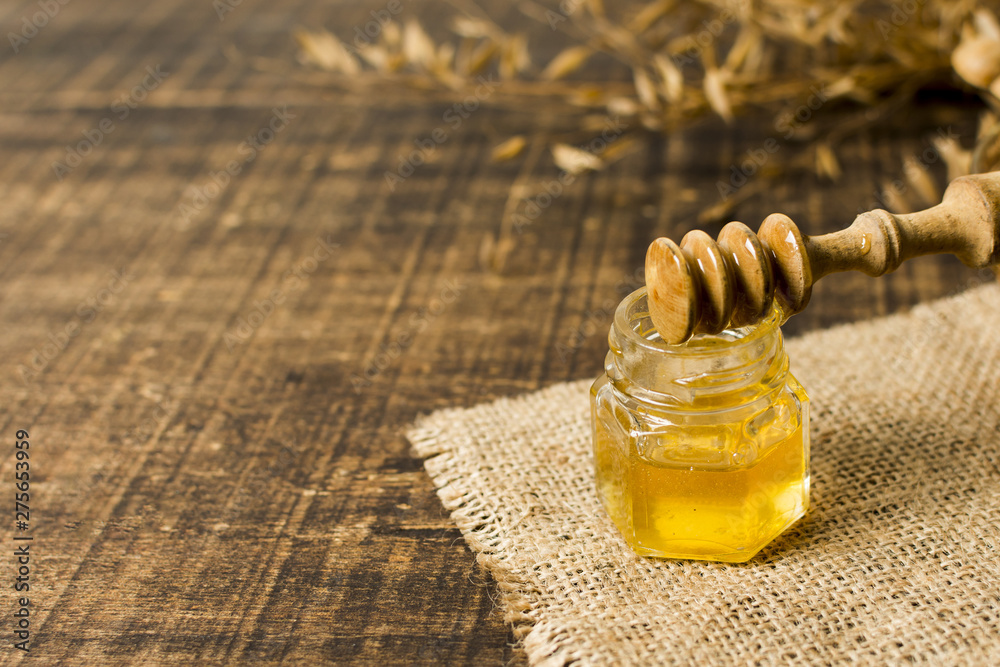 Honey spoon on jar