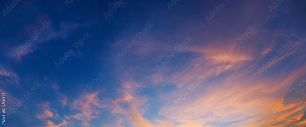 Beautiful sunset sky with clouds. Nature background. Panorama view.