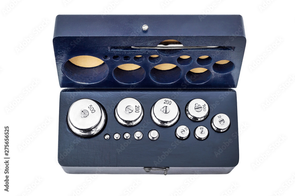 Set of weights for laboratory scales in box. Isolated on white. Set of weights for laboratory scales in box. Isolated on white.