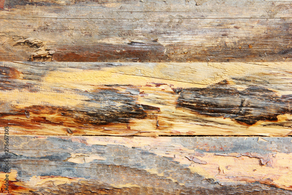 yellow brown wooden board texture with cracks, stains and scratches yellow brown wooden board texture with cracks, stains and scratches