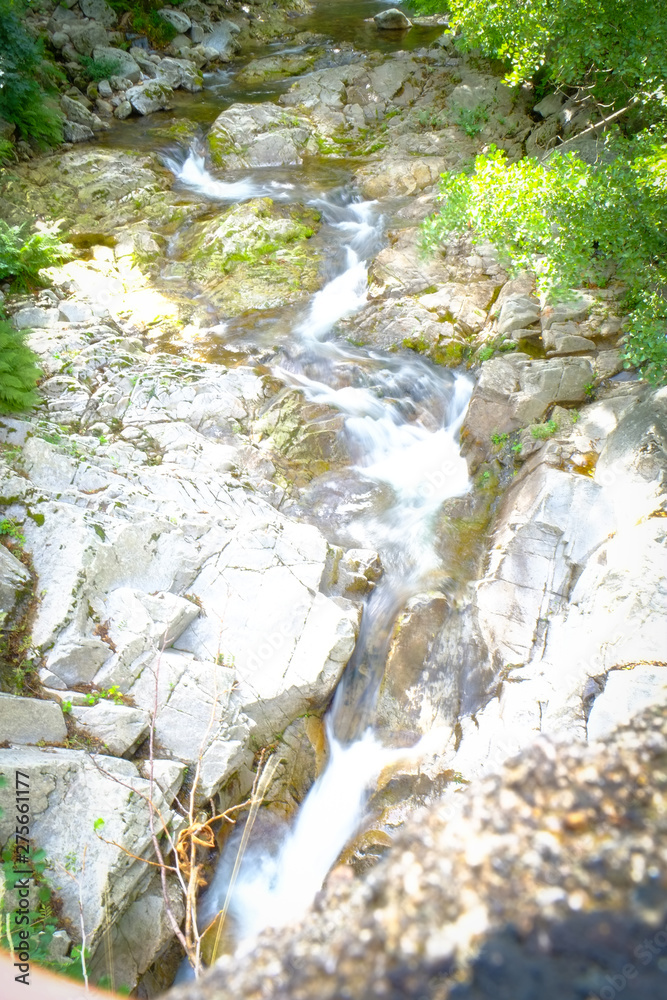 Water from a spring in the forests flowing down from the mountains in the Ardeche area in France