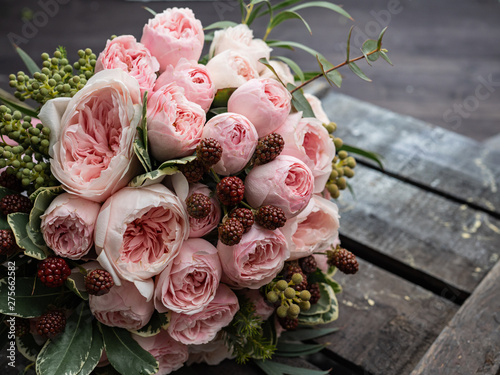Beautiful wedding bouquet of shrub and peony gently pink roses.
