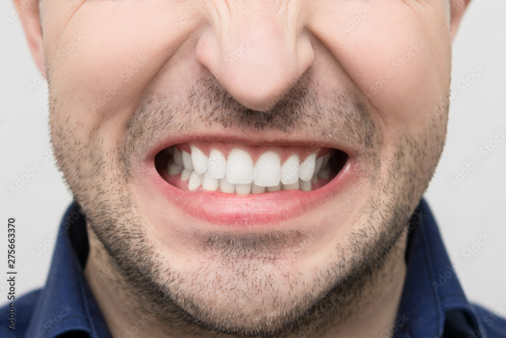 Anger on the face of a young bearded man, closeup, concept of human emotion Anger on the face of a young bearded man, closeup, concept of human emotion