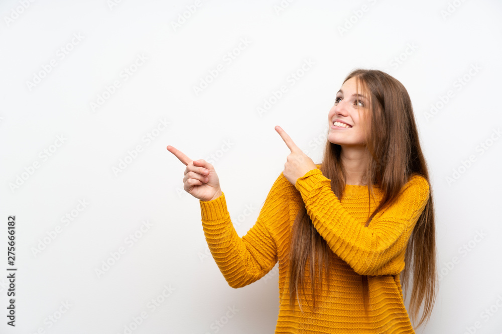 Young woman with yellow over isolated white wall pointing with the index finger a great idea Young woman with yellow over isolated white wall pointing with the index finger a great idea