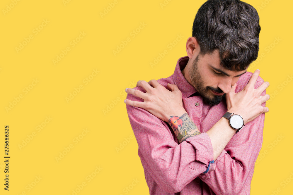 Young handsome man wearing pink shirt over isolated background Hugging oneself happy and positive, smiling confident. Self love and self care Young handsome man wearing pink shirt over isolated background Hugging oneself happy and positive, smiling confident. Self love and self care