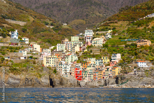 Liguria, Italy coastline of Riviera with colorful houses on sunny warm day. Monterosso al Mare, Vernazza, Corniglia, Manarola and Riomaggiore, Cinque Terre National Park UNESCO World Heritage © Irina Schmidt