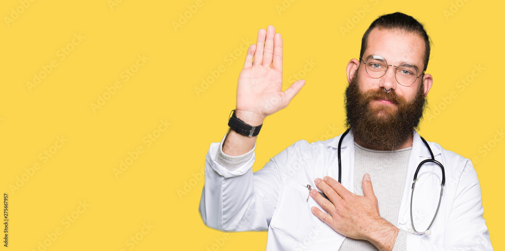 Young blond doctor man with beard wearing medical coat Swearing with hand on chest and open palm, making a loyalty promise oath Young blond doctor man with beard wearing medical coat Swearing with hand on chest and open palm, making a loyalty promise oath