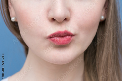 The face of a beautiful woman  pout lips  playful woman  close up