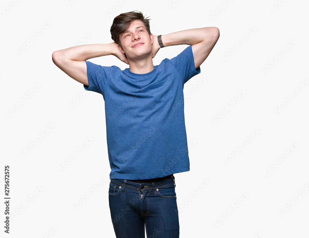 Young handsome man wearing blue t-shirt over isolated background Relaxing and stretching with arms and hands behind head and neck, smiling happy Young handsome man wearing blue t-shirt over isolated background Relaxing and stretching with arms and hands behind head and neck, smiling happy