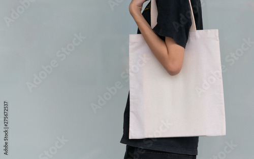 woman carry bag on nature background in save earth concept or say no plastic bag.