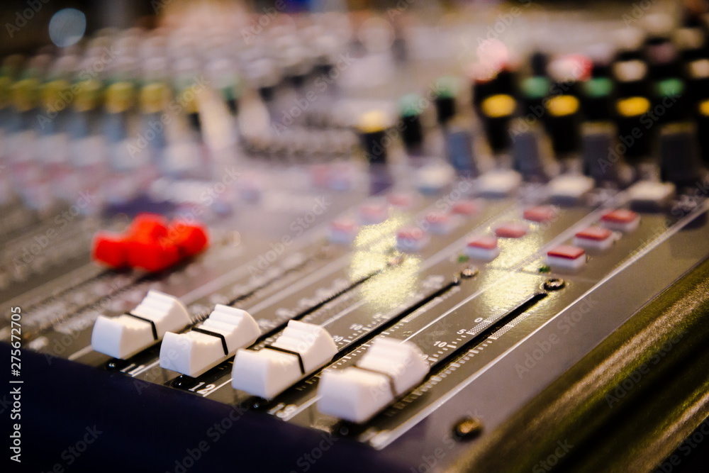 sound mixing control , close up pattern and texture of white music switch . sound mixing control , close up pattern and texture of white music switch .