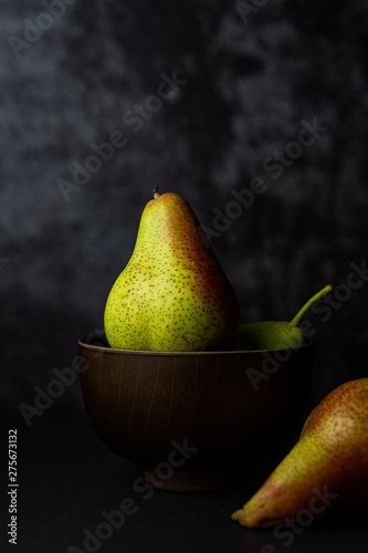 Forelle pears on dark background. Selective focus. photo