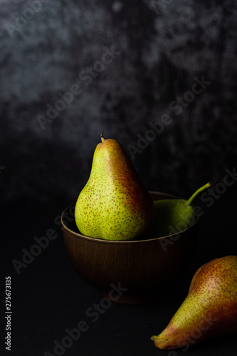 Forelle pears on dark background. Selective focus. photo