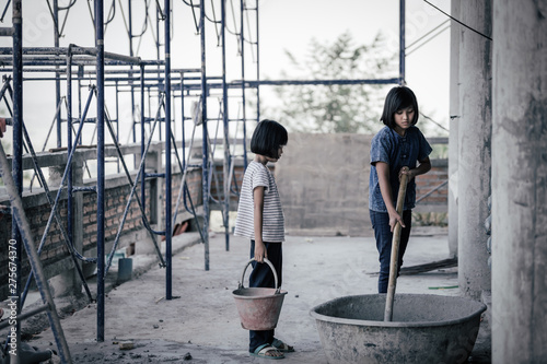 Children are forced to work in the construction area. Human rights concepts, stopping child abuse, violence, fear of child labor and human trafficking