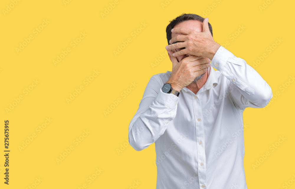 Handsome middle age elegant senior business man wearing glasses over isolated background Covering eyes and mouth with hands, surprised and shocked. Hiding emotion Handsome middle age elegant senior business man wearing glasses over isolated background Covering eyes and mouth with hands, surprised and shocked. Hiding emotion
