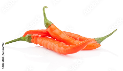 Three orange hot chili pepper isolated on white background