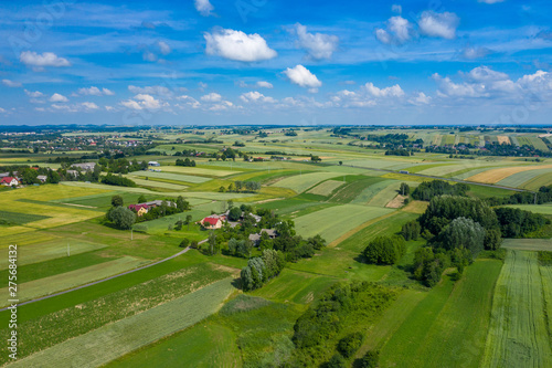 Aerial view of farmlands and mountains in rural Poland seen from drone. Summer time.