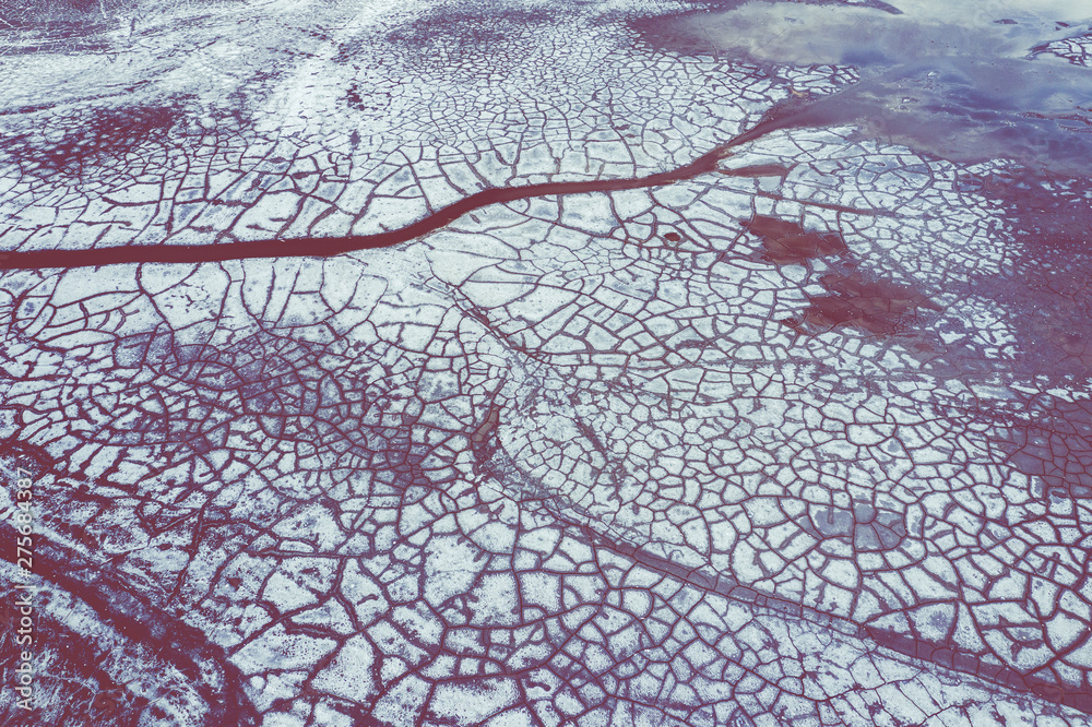 Aerial view of surrealistic industrial place. Dry surface. Desertic landscape. Human impact on the environment. View from above. Abstract industrial background. Aerial view of surrealistic industrial place. Dry surface. Desertic landscape. Human impact on the environment. View from above. Abstract industrial background.