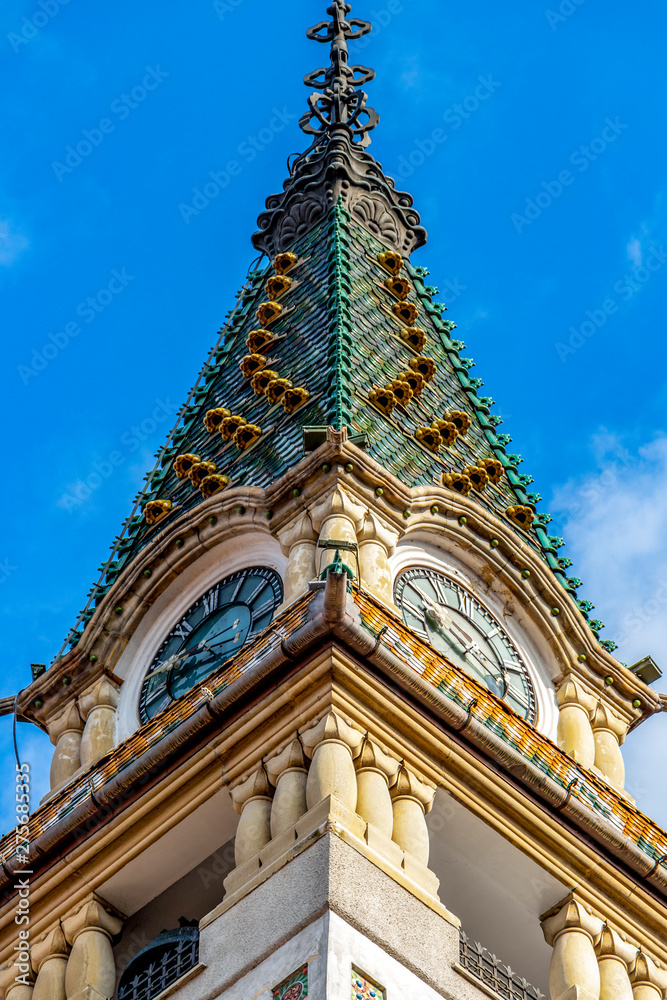 Spire of the Art Nouveau Prefecture Building, Headquarters of Mures County Council or former City Hall in Targu Mures, Transylvania Romania, close low-angle view