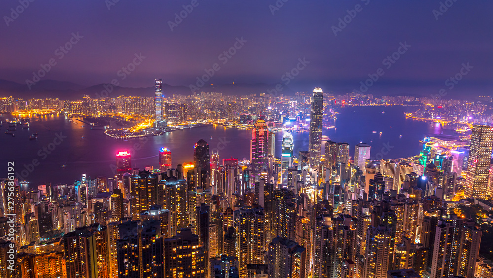 High view of Hong Kong skyline cityscape night light over Victoria harbour at Victoria Peak