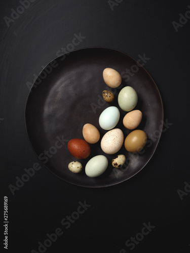 Colorful Eggs on Black Plate