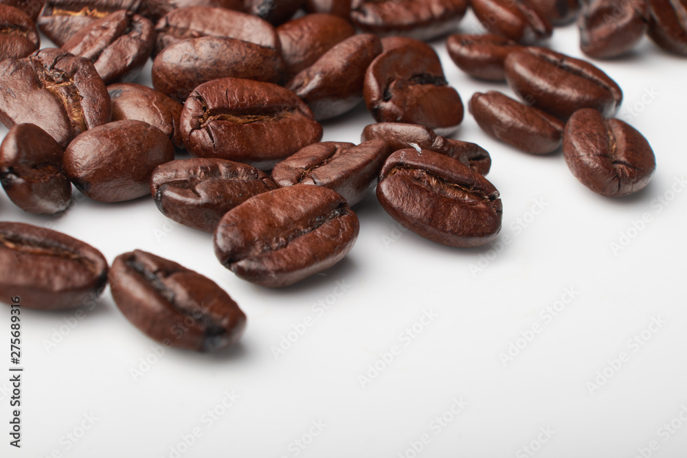 aromatic roasted coffee beans on white background aromatic roasted coffee beans on white background