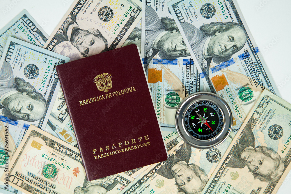 international compass in dollars in the background. international compass in dollars in the background.