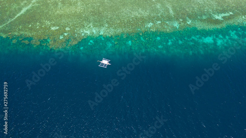 Boat on the Philippines - Aerial drone photo of ship on coral reef. Philippine boat at the coral reef, view from above.